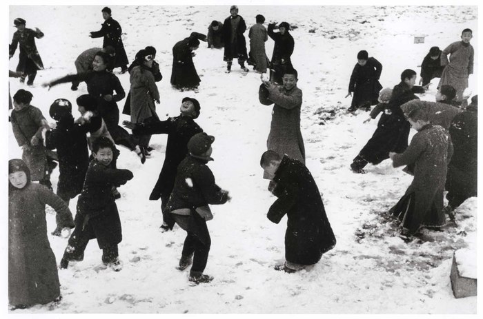 children playing in the snow